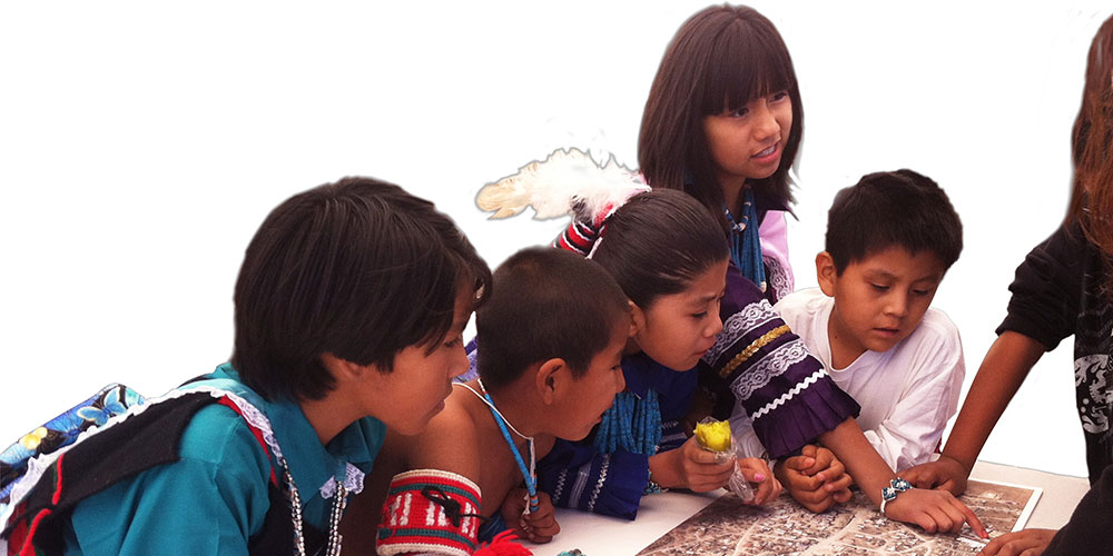 Kids looking at the plan document